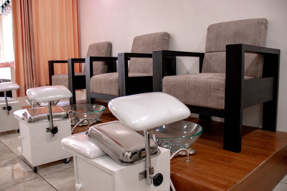 Cozy pedicure chairs and foot baths in a modern salon setting.